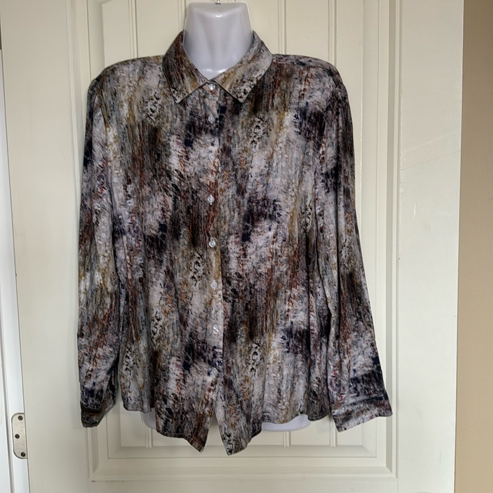 Multi coloured top with long sleeves with button cuffs at the wrist. Size M